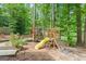 Backyard wooden playset with a slide, climbing wall and playhouse, perfect for Gathering fun at 105 Oak Leaf Ct, Fayetteville, GA 30214