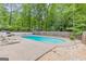 Backyard featuring a refreshing in-ground pool and surrounding patio space at 105 Oak Leaf Ct, Fayetteville, GA 30214