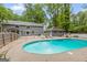 Backyard with a in-ground pool, patio area, and well-maintained yard at 105 Oak Leaf Ct, Fayetteville, GA 30214