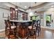 Beautiful basement bar features granite countertop and wood accents at 4185 Etcetera Ln, Cumming, GA 30041