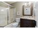 Bathroom featuring a shower, toilet, vanity with granite countertop, and stylish fixtures at 4185 Etcetera Ln, Cumming, GA 30041