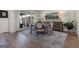 Dining area featuring light wood floors, a patterned rug, and a glass wall for seamless indoor-outdoor living at 4185 Etcetera Ln, Cumming, GA 30041