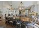 Spacious dining room showcases modern light fixtures and convenient access to kitchen and living areas at 4185 Etcetera Ln, Cumming, GA 30041