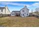 Expansive backyard featuring a wooden deck, a large grassy area, and a privacy fence at 4439 Persian Ct, Snellville, GA 30039