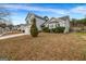 View of a house, showing the side and front of the house, with a well-maintained lawn at 4439 Persian Ct, Snellville, GA 30039