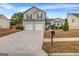 Charming two-story home featuring a two-car garage, well-kept lawn, and inviting front entrance at 4439 Persian Ct, Snellville, GA 30039