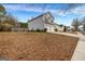 View of a well-maintained front yard of a two-story home with lawn and driveway at 4439 Persian Ct, Snellville, GA 30039