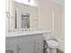 Bathroom features a marble vanity, white cabinets, and brushed nickel hardware at 309 Coral Cir, Mcdonough, GA 30253