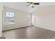 Spacious bedroom features hardwood floors, neutral paint, and a ceiling fan at 309 Coral Cir, Mcdonough, GA 30253