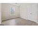 Bedroom features hardwood floors, neutral paint, and a double-door closet at 309 Coral Cir, Mcdonough, GA 30253