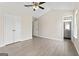 Bedroom features hardwood floors, neutral paint, and a bathroom ensuite at 309 Coral Cir, Mcdonough, GA 30253