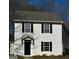 Charming two-story home features black shutters and neutral siding at 309 Coral Cir, Mcdonough, GA 30253