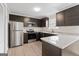 Updated kitchen featuring stainless steel appliances and granite counters at 309 Coral Cir, Mcdonough, GA 30253