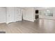 Open-concept living room features wood floors and white doors at 309 Coral Cir, Mcdonough, GA 30253
