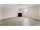 Spacious living room featuring wood floors, a fireplace, and a light fixture at 309 Coral Cir, Mcdonough, GA 30253