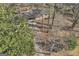 An aerial shot showcases a lovely home nestled amid lush trees and a lengthy driveway at 6198 Rocky Creek Dr, Douglasville, GA 30135