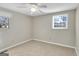 Cozy bedroom featuring neutral carpet and two windows for natural light at 6198 Rocky Creek Dr, Douglasville, GA 30135