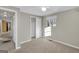 Well-lit bedroom with closet, window, and doorway leading to other rooms at 6198 Rocky Creek Dr, Douglasville, GA 30135