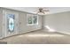 Bedroom featuring neutral carpet, ceiling fan and an exterior door at 6198 Rocky Creek Dr, Douglasville, GA 30135