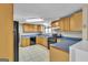 Kitchen featuring light wood cabinets, gas range and black appliances at 6198 Rocky Creek Dr, Douglasville, GA 30135