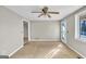 Living Room with neutral carpet, ceiling fan and door to the backyard at 6198 Rocky Creek Dr, Douglasville, GA 30135