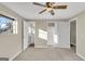 Spacious main bedroom with ensuite bathroom and closet featuring neutral carpet at 6198 Rocky Creek Dr, Douglasville, GA 30135