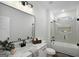 Bathroom featuring a tub and shower combo, vanity with granite countertop, and elegant fixtures at 5167 Martin St, Covington, GA 30014