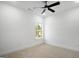 Cozy bedroom features neutral carpet and a modern ceiling fan for comfort at 5167 Martin St, Covington, GA 30014