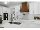 Modern kitchen features white cabinets, granite countertops, and stainless steel appliances at 5167 Martin St, Covington, GA 30014