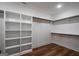 Spacious walk-in closet with custom shelving and hanging rods, offering ample storage for clothing and accessories at 5167 Martin St, Covington, GA 30014
