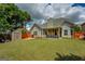Large, grassy backyard features storage shed and mature trees at 1186 Diamond Xing, Mcdonough, GA 30252