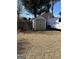 A backyard view showcasing a storage shed and white van at 1186 Diamond Xing, Mcdonough, GA 30252