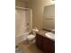 Cozy full bathroom featuring a shower-tub combo, large mirror, and brown vanity with a white sink at 1186 Diamond Xing, Mcdonough, GA 30252