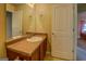 Bathroom with a large mirror, vanity with sink, and a white paneled door at 1186 Diamond Xing, Mcdonough, GA 30252