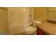 Bright bathroom featuring a shower and bath combination with neutral tile flooring at 1186 Diamond Xing, Mcdonough, GA 30252