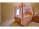 Charming bedroom with a canopy bed, natural light, and a warm ambiance at 1186 Diamond Xing, Mcdonough, GA 30252