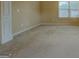 Neutral-toned bedroom with carpeting, natural light, and a white pillar at 1186 Diamond Xing, Mcdonough, GA 30252
