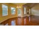 Sunny breakfast nook with hardwood floors, large windows, and a view of the backyard at 1186 Diamond Xing, Mcdonough, GA 30252