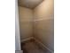 Walk-in closet featuring wire shelving, carpet floors, and neutral paint at 1186 Diamond Xing, Mcdonough, GA 30252