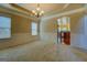 Bright dining room featuring traditional wainscoting and an elegant chandelier at 1186 Diamond Xing, Mcdonough, GA 30252