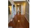 Inviting foyer featuring gleaming hardwood floors, decorative columns, and neutral paint tones at 1186 Diamond Xing, Mcdonough, GA 30252