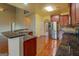 Modern kitchen with granite countertops, stainless steel appliances, and hardwood floors at 1186 Diamond Xing, Mcdonough, GA 30252