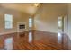 Spacious living room features hardwood floors and natural light from large windows at 1186 Diamond Xing, Mcdonough, GA 30252