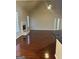 Bright living room with vaulted ceiling, cozy fireplace, and laminate floors at 1186 Diamond Xing, Mcdonough, GA 30252