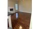 Spacious living room featuring a fireplace, large windows, and laminate floors at 1186 Diamond Xing, Mcdonough, GA 30252