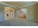 Inviting living room with staircase, beautiful architectural details, and a neutral color scheme at 1186 Diamond Xing, Mcdonough, GA 30252