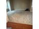 Expansive living room featuring plush carpeting and a large window for ample natural light at 1186 Diamond Xing, Mcdonough, GA 30252