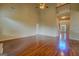 Bright, open living room boasts soaring ceilings and gleaming hardwood floors at 1186 Diamond Xing, Mcdonough, GA 30252
