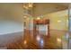Bright open-concept living space with hardwood floors, high ceilings, and a seamless flow between rooms at 1186 Diamond Xing, Mcdonough, GA 30252
