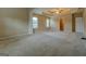Spacious main bedroom with tray ceiling, large windows, and neutral carpeting at 1186 Diamond Xing, Mcdonough, GA 30252